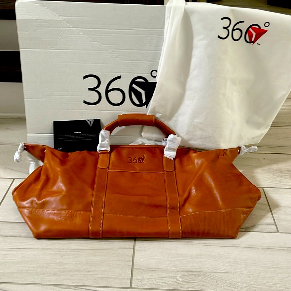 Delta 360 leather travel bag. Never used. Dust bag included.